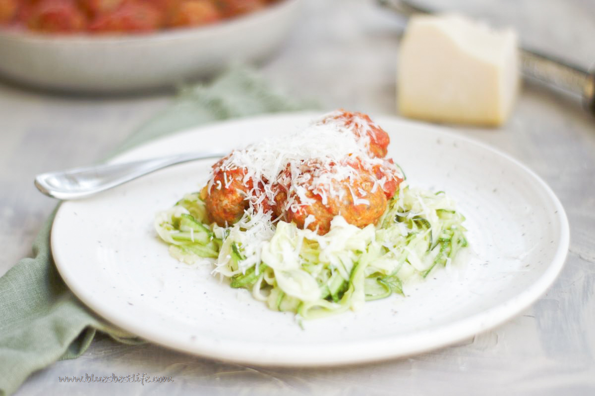 a plate of meatballs with zucchini noodles 