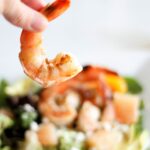 Grilled shrimp on a salad with avocado, mandarin oranges, grapefruit, slivered almonds with citrus vinaigrette