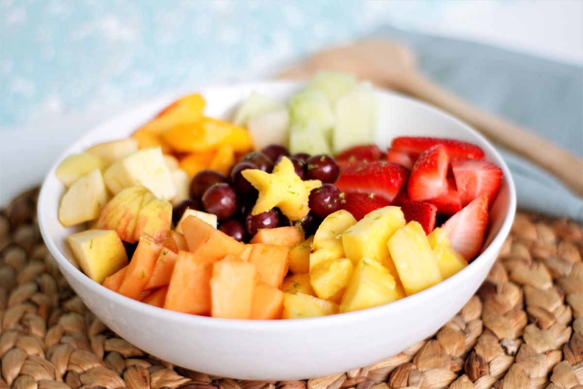 a bowl with honey lime fruit salad