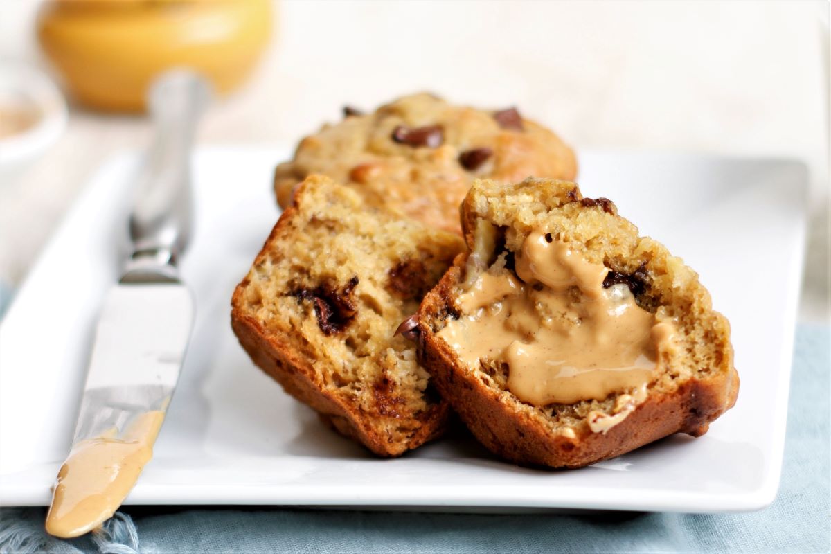 peanut butter banana muffins with a smear of peanut butter