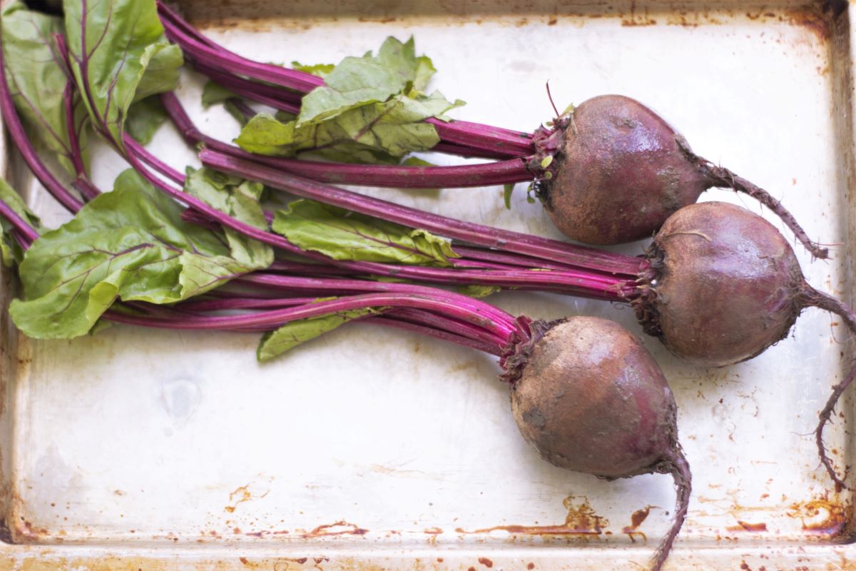 a baking sheet with a bunch of beets