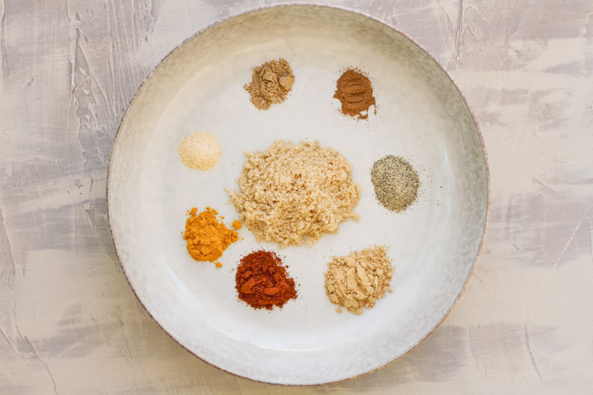 A bowl with spices to make Moroccan spice rub