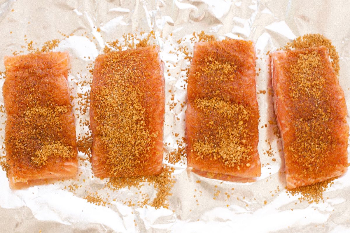 Salmon on foil lined baking sheet with Moroccan spice rub