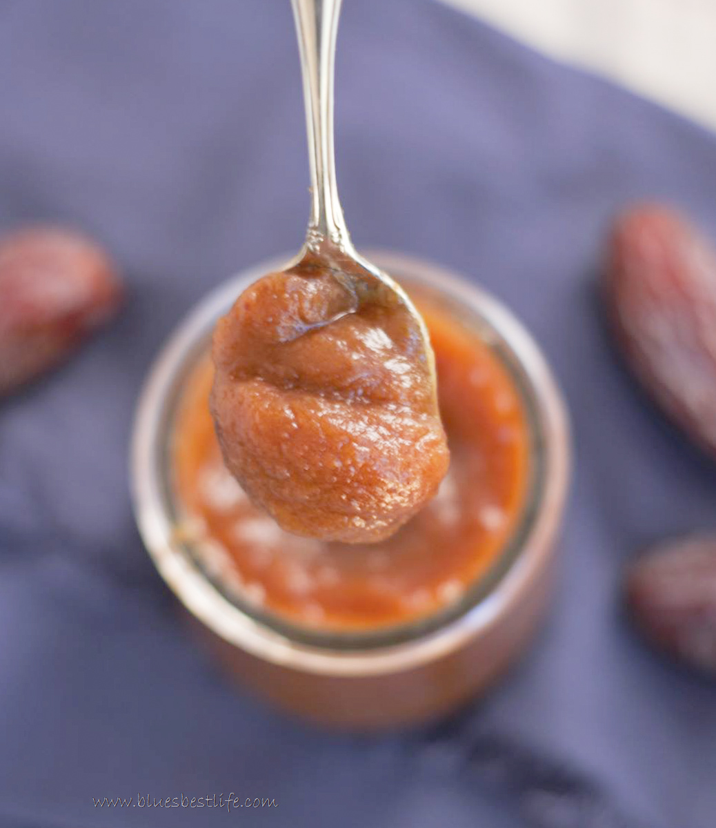 A spoonful of date paste in a jar 