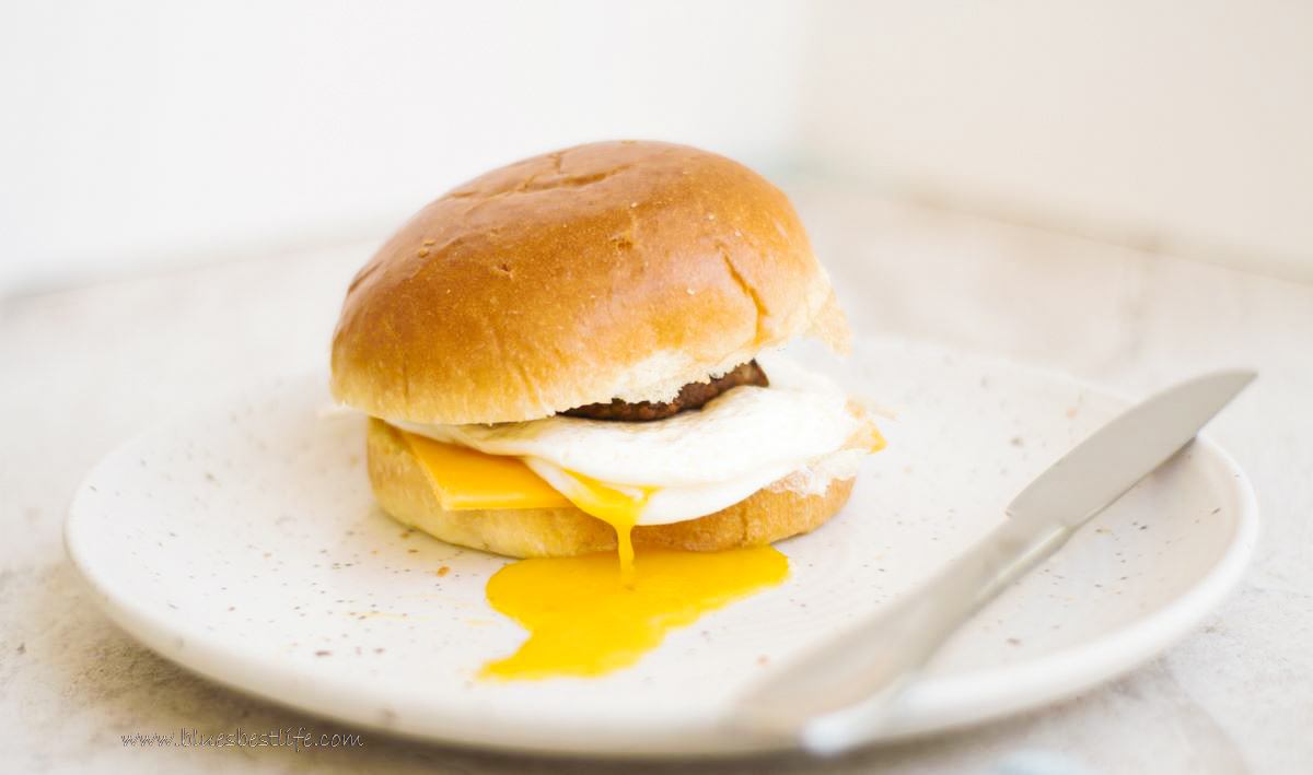 a fried egg sandwich on a brioche bun