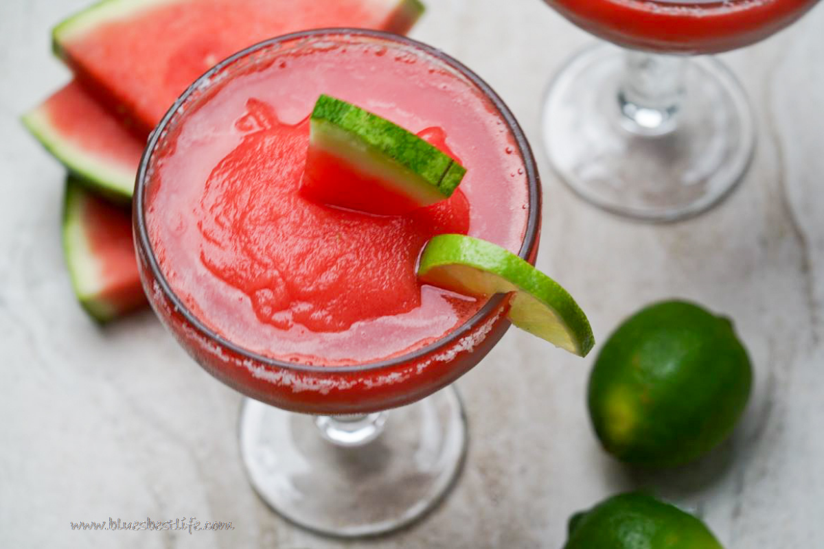 A watermelon Margarita in a glass with salted rim