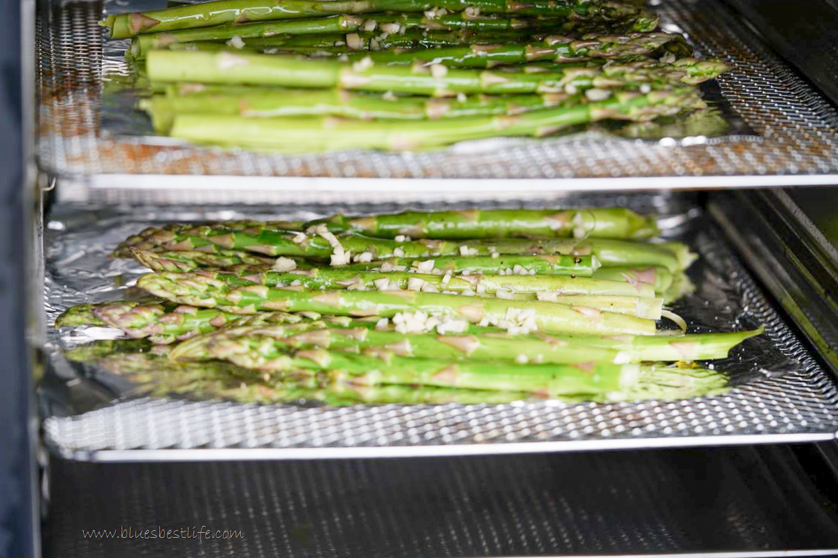 Asparagus on racks inside air fryer