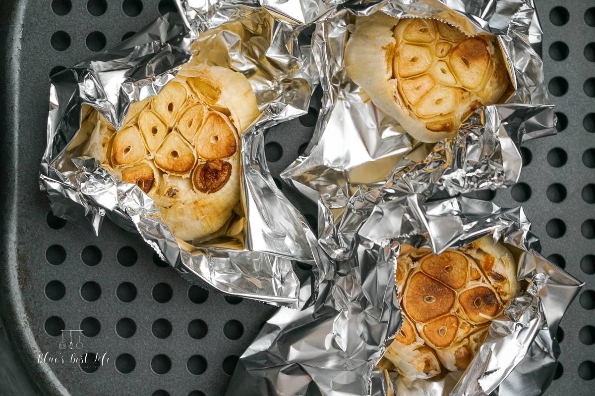 roasted garlic in the basket of the air fryer