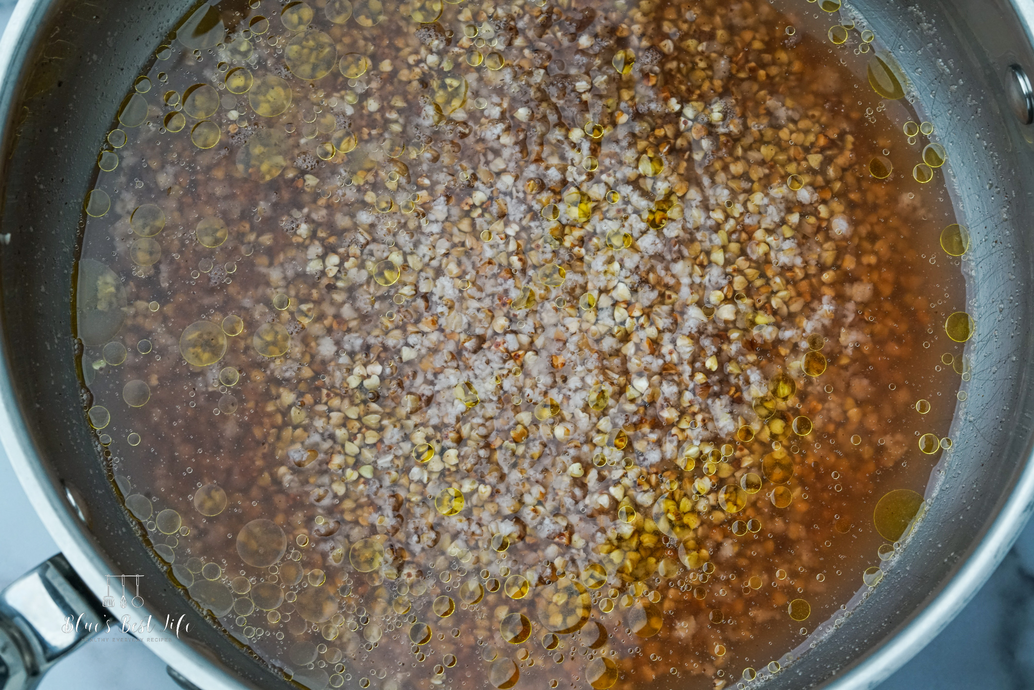 Adding the water to the toasted buckwheat. 