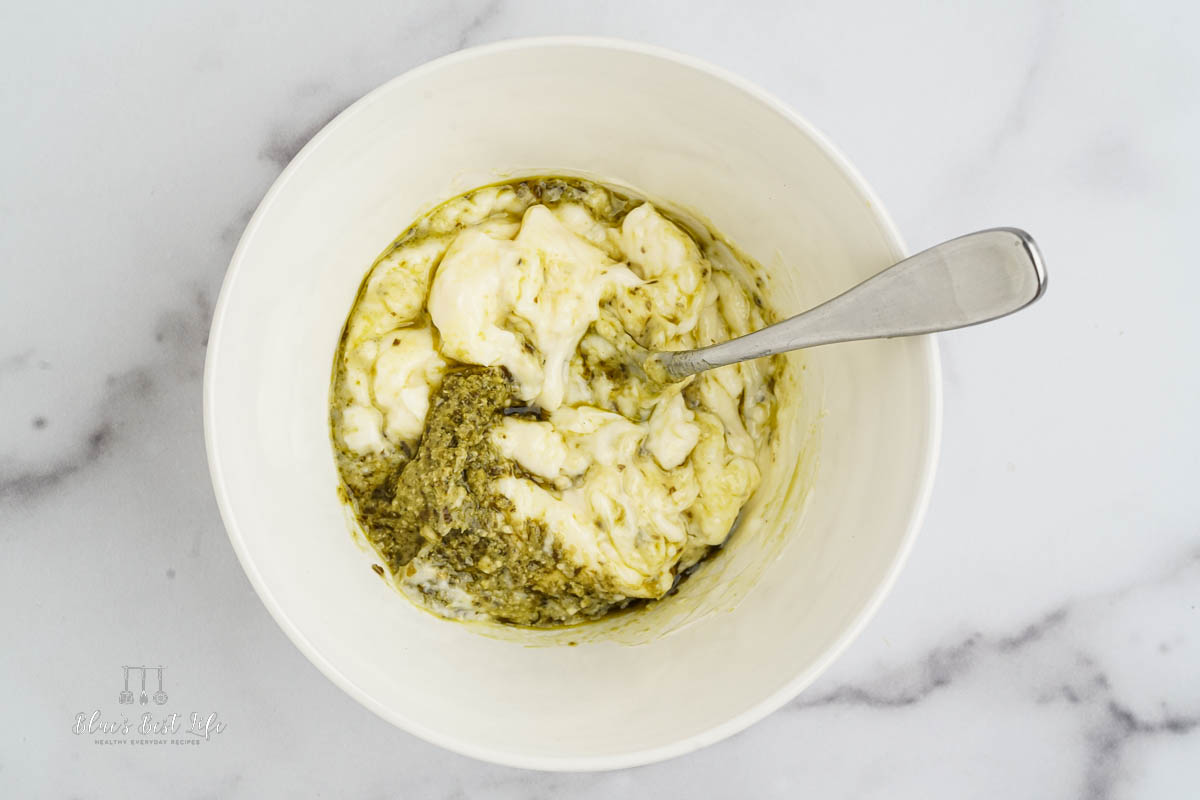 mixing together the pesto and mayo