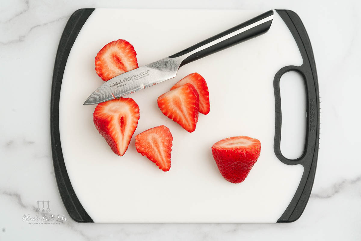 Cutting strawberries.