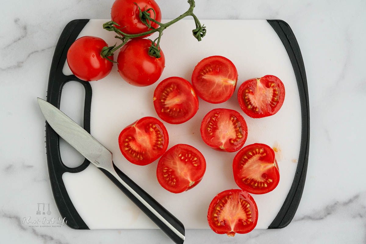 slicing tomatoes on a chopping board