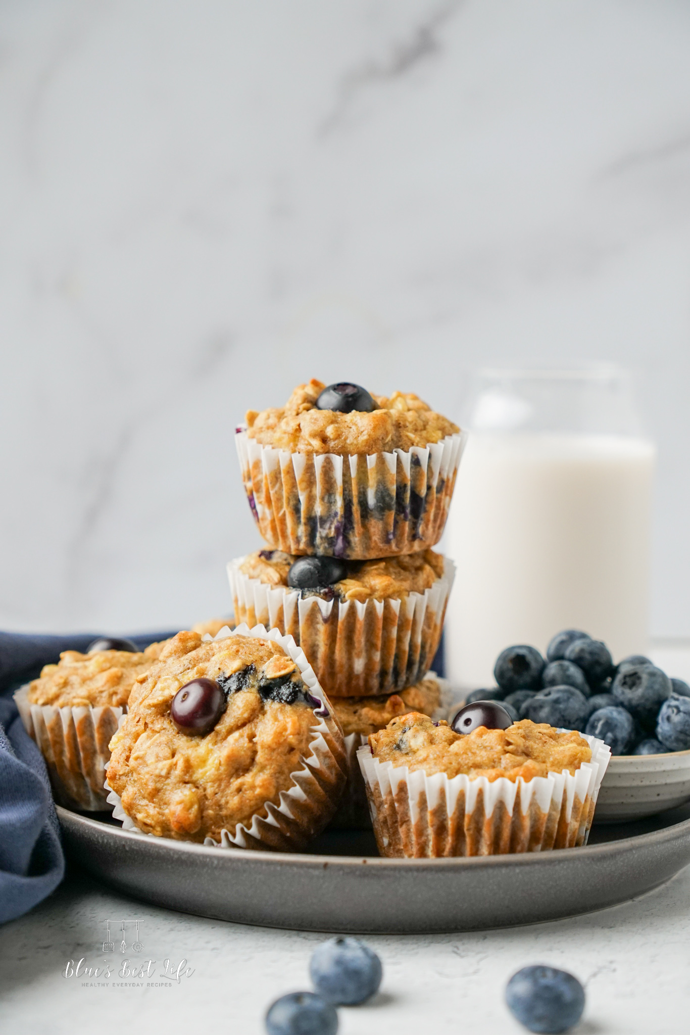 A stack of blueberry banana oat muffins. 