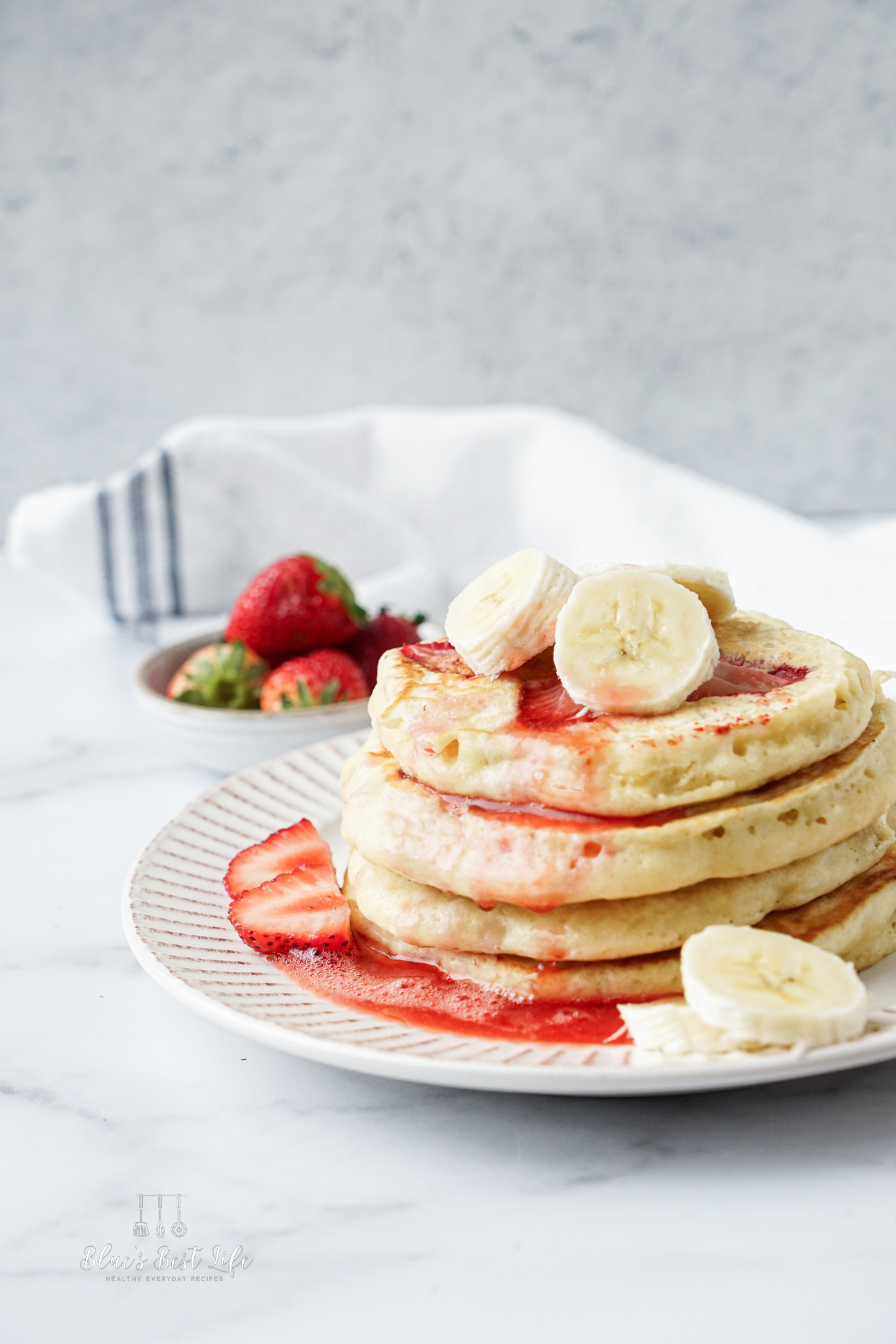 The stack of banana strawberry pancakes.  