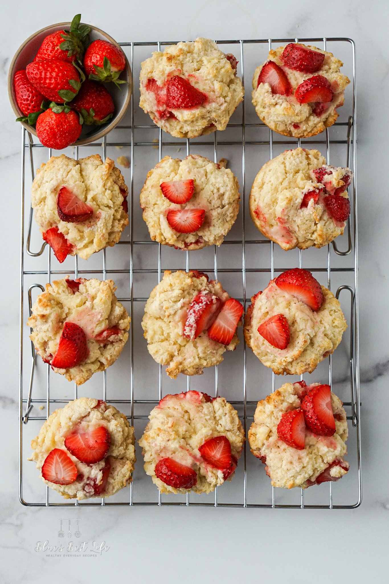 Strawberry Shortcake Muffins cooling on a wire rack.