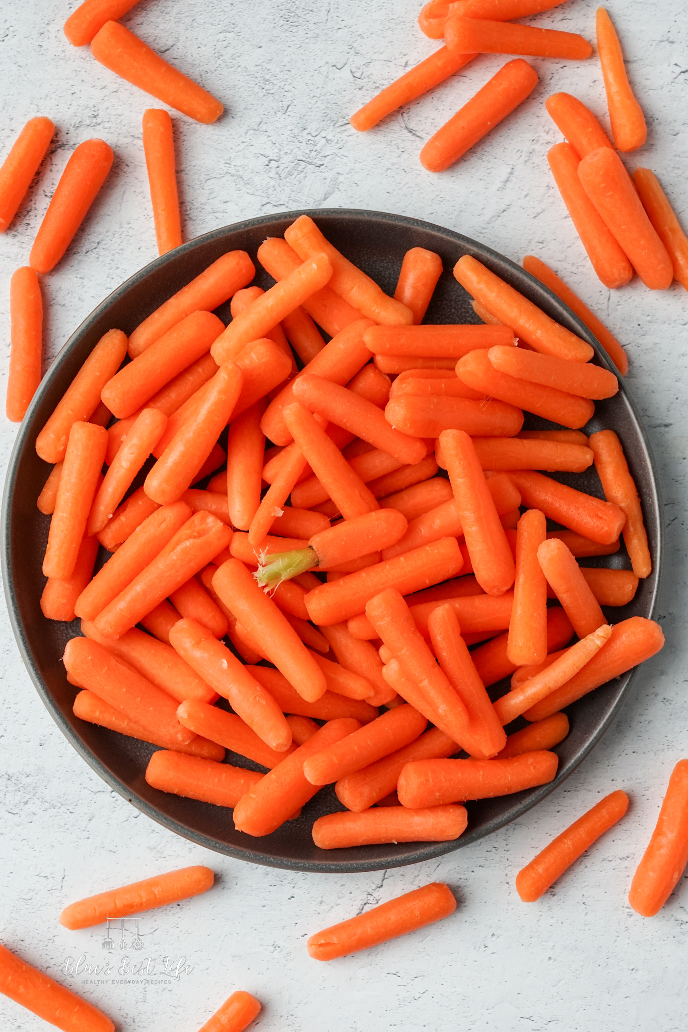 Baby carrots on a plate. 