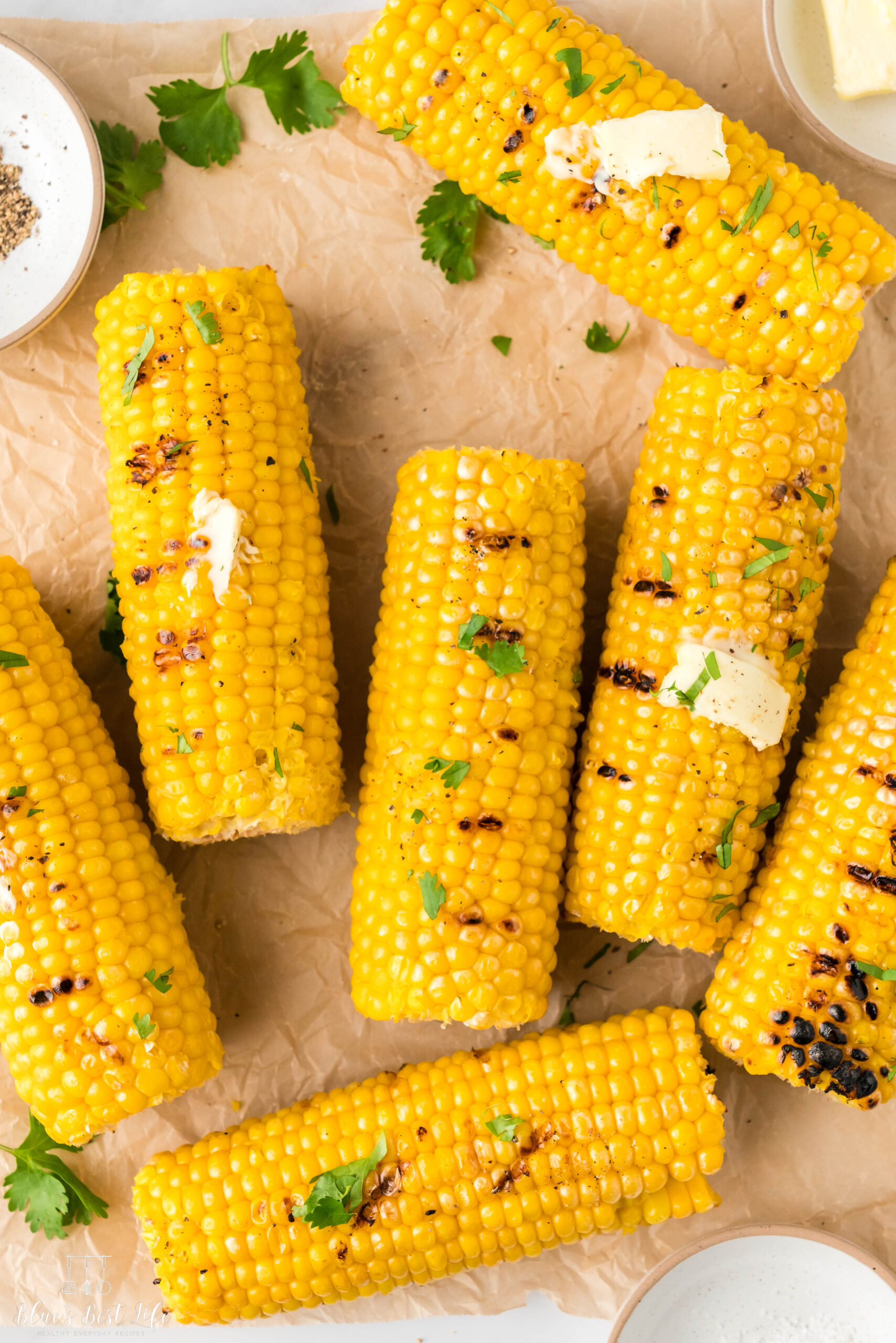 Grilled corn on the cob with butter melted overtop.