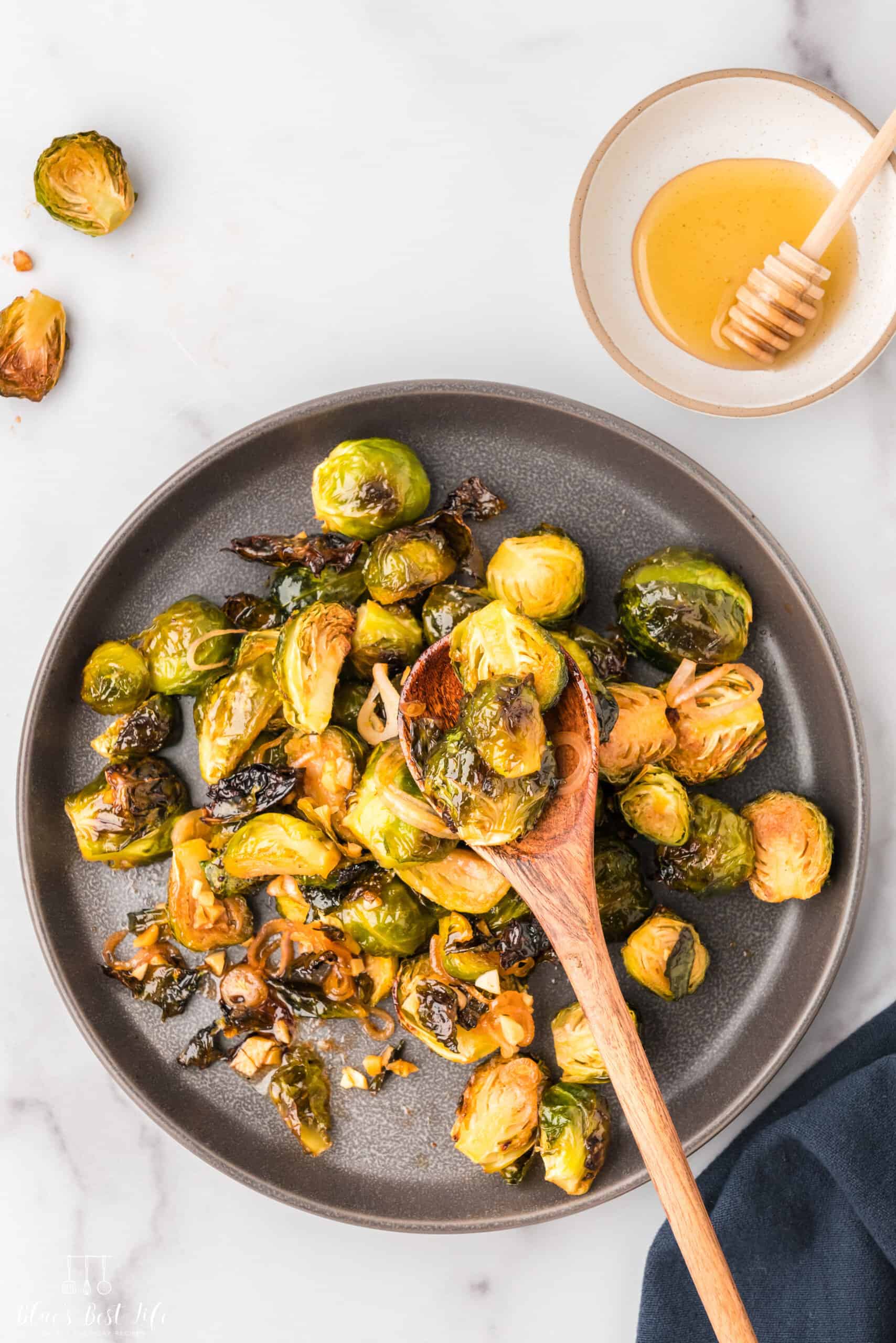 The brussels sprouts on a serving plate.