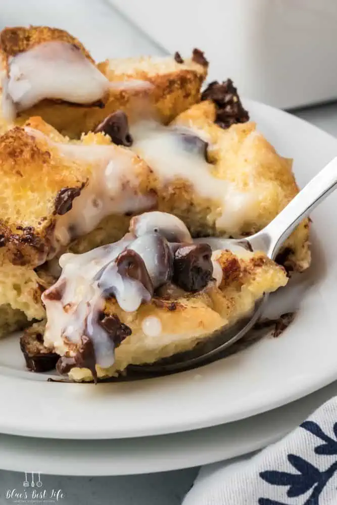 A spoonful of chocolate chip bread pudding. 