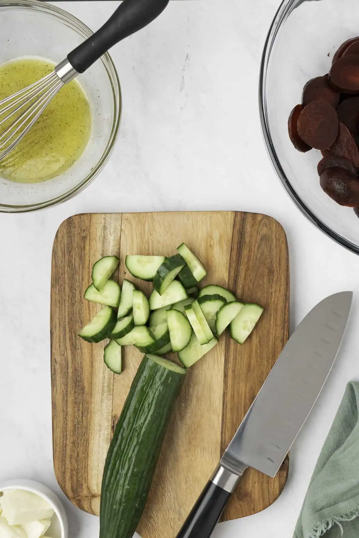 The cucumber sliced on a cutting board. 