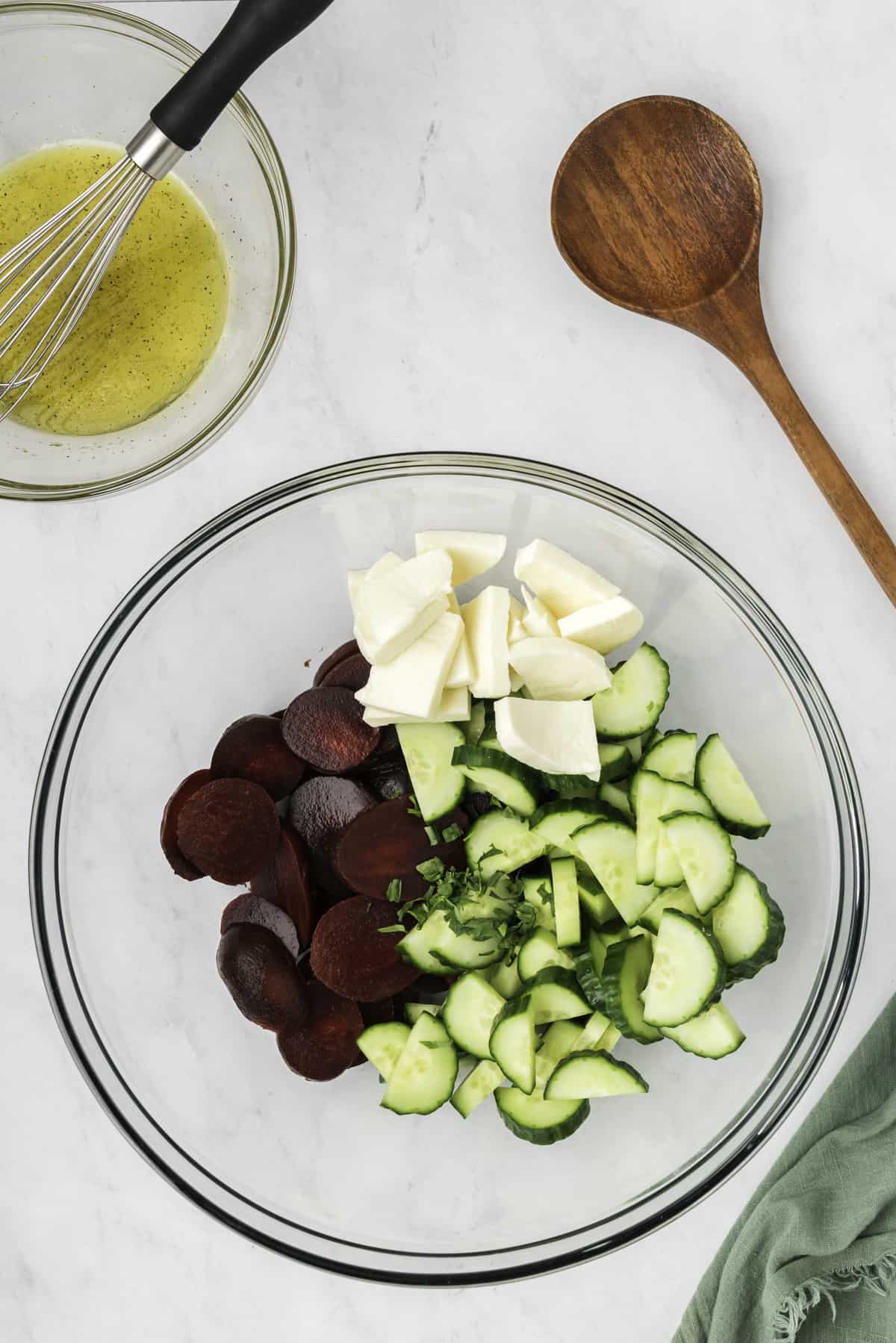 The ingredients for the salad in a large mixing bowl. 