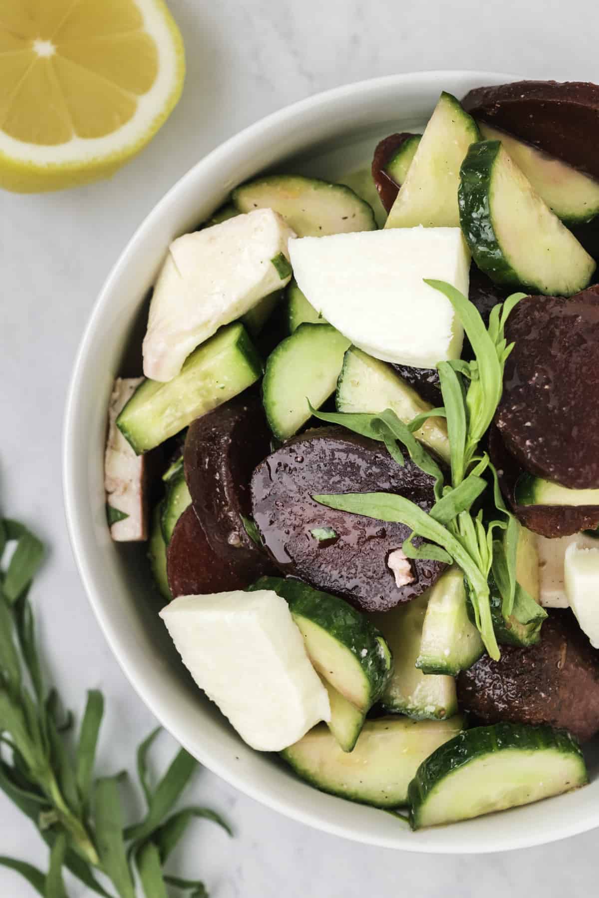 A bowl of beet and cucumber salad. 