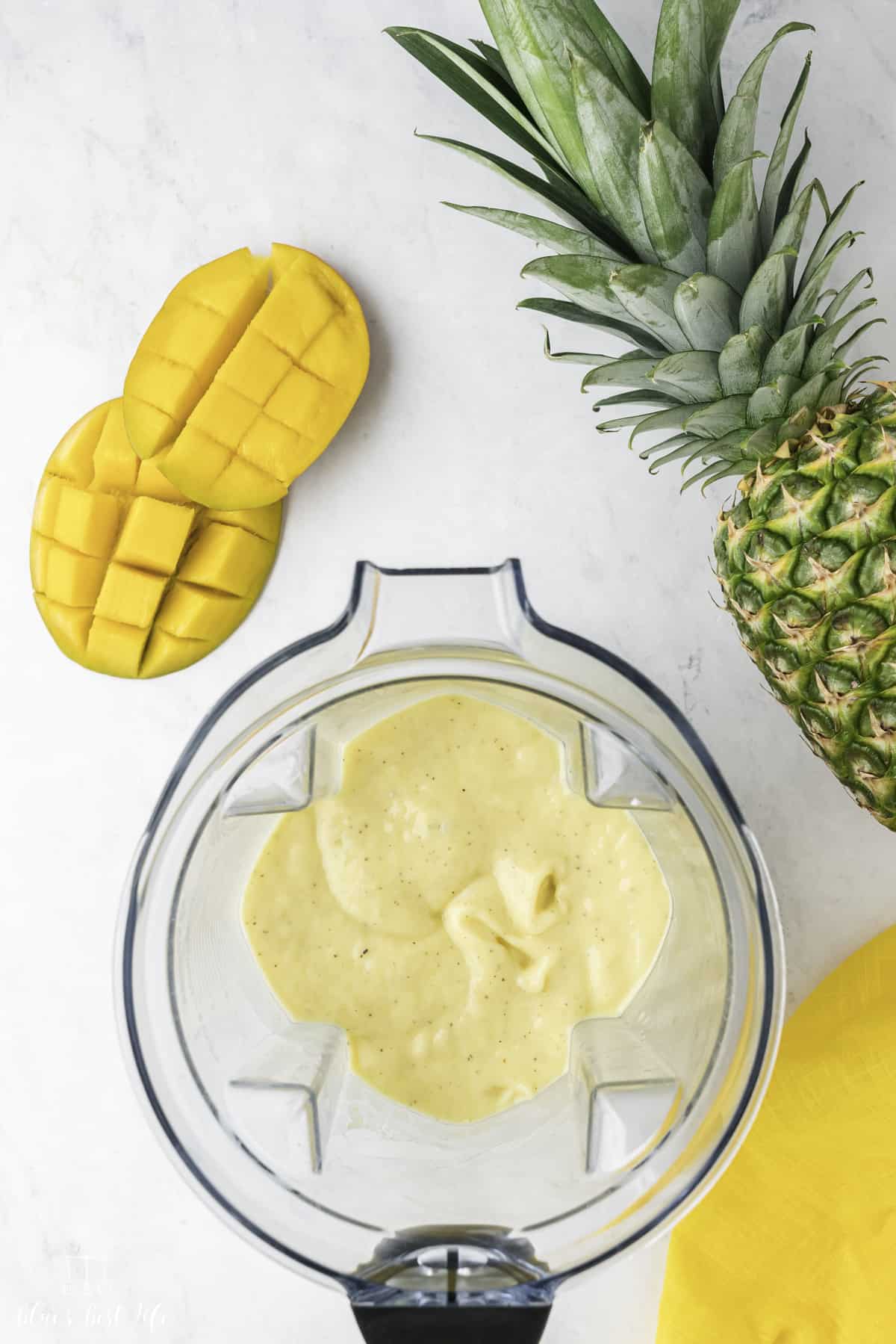 Side-by-side photo: Left: Pineapple, and other ingredients in a blender. Right: completely blended pineapple smoothie in a blender. 