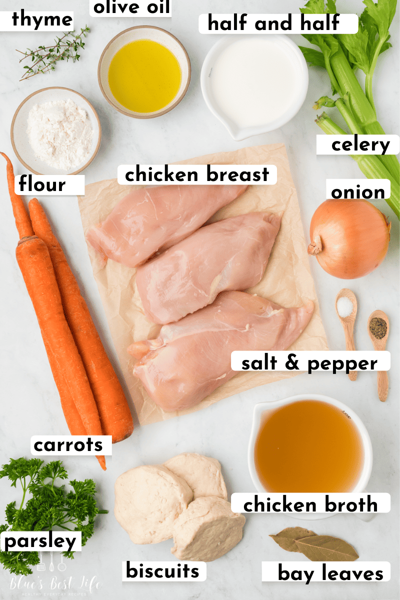 The ingredients for chicken and dumplings with canned biscuits: Thyme, Olive Oil, Half & Half, flour, chicken breasts, onion, celery, carrots, salt & pepper, Parsley, biscuits, chicken broth, bay leaves. 