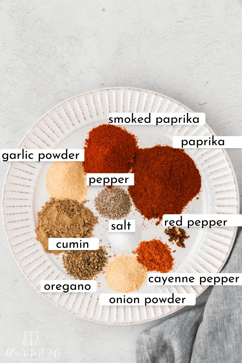 The spices for chicken tacos on a plate.