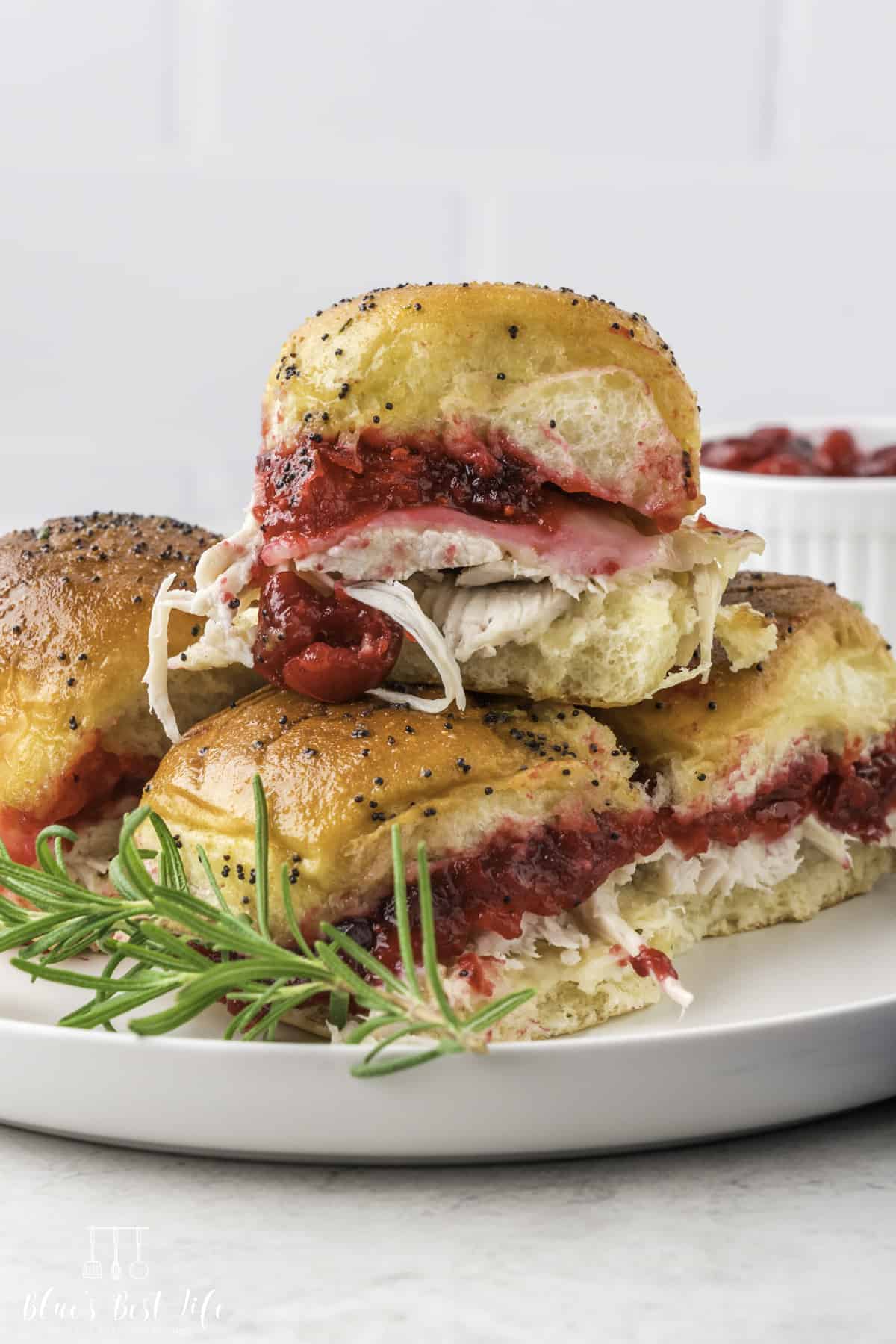 Four pieces of sliders out of the oven served on a plate. 