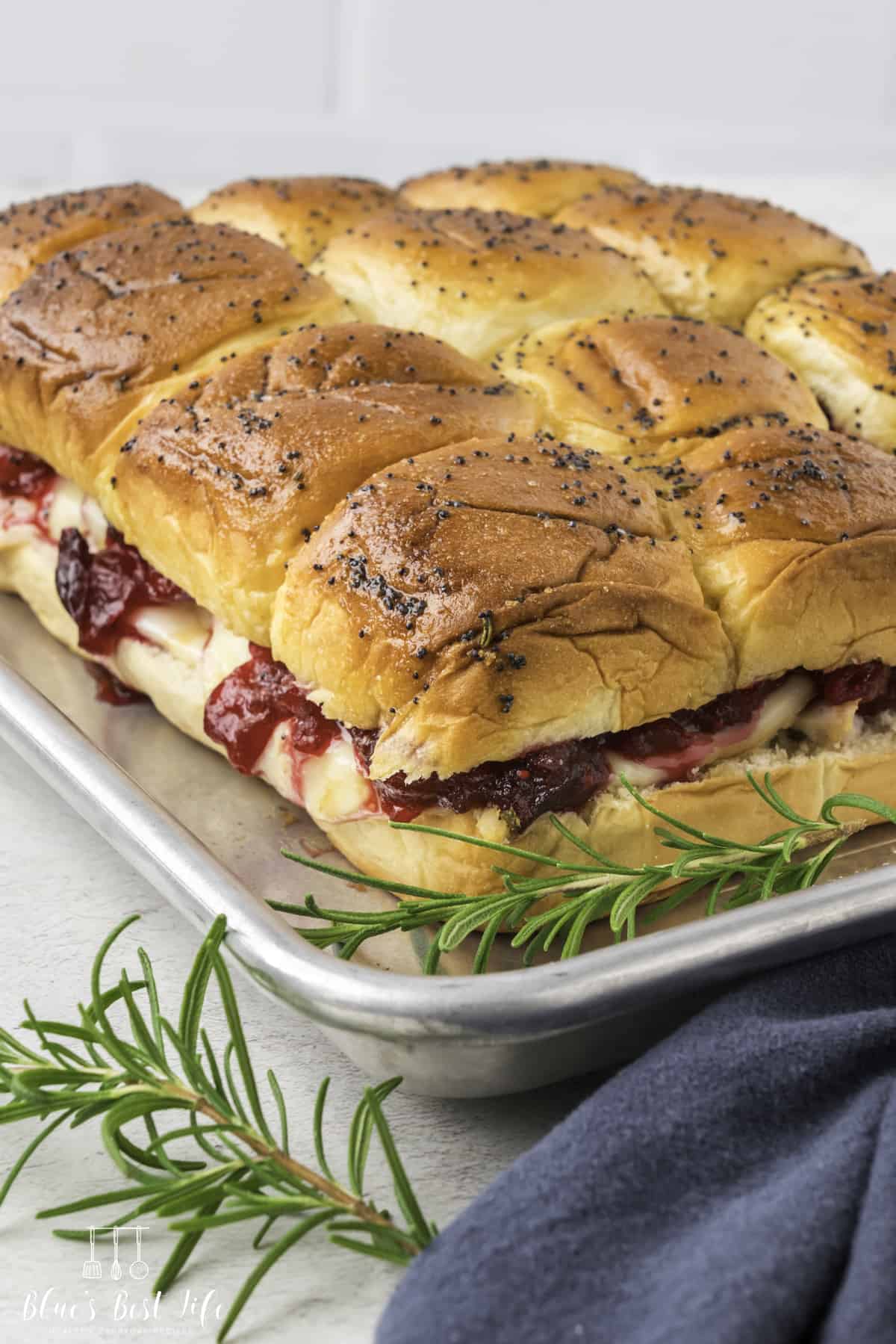 The sliders on a baking tray. 