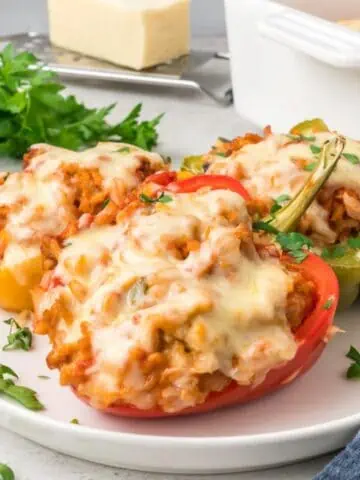 The chicken stuffed peppers on a plate.