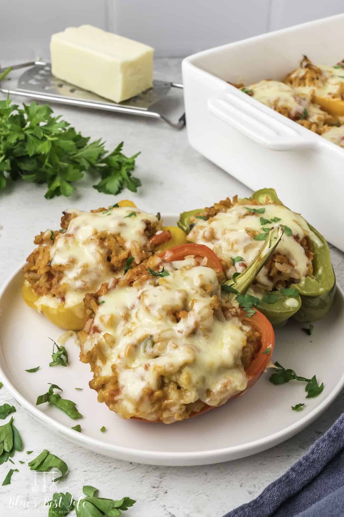 The stuffed peppers on a plate. 