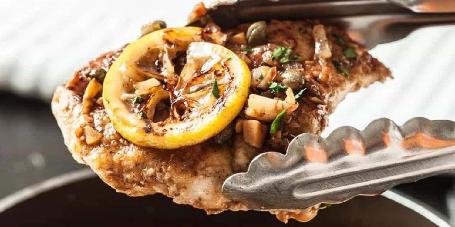 A thong holding a Chicken Piccata. 