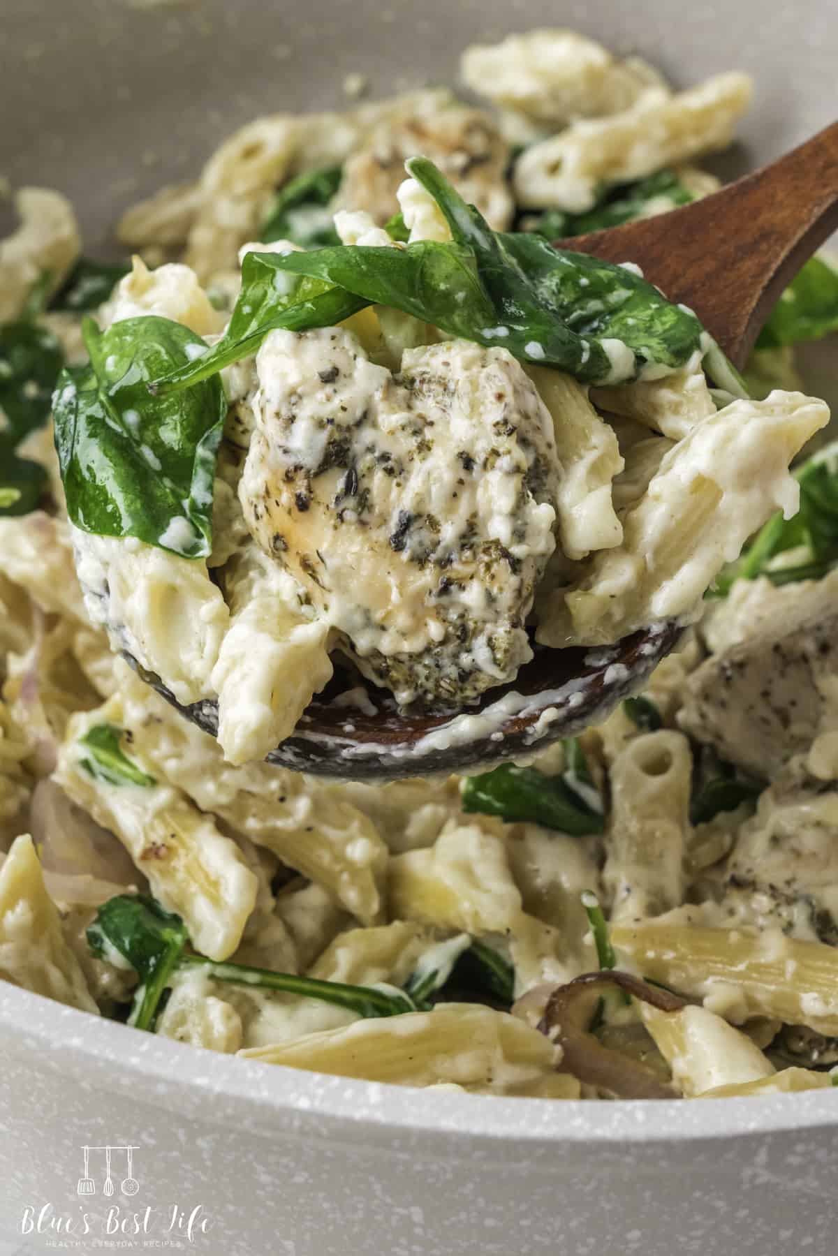 A spoonful of the chicken spinach pasta. 
