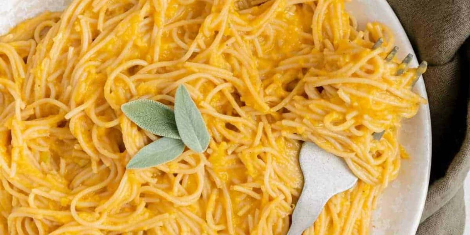 A close-up shot of pumpkin pasta served on a plate. 