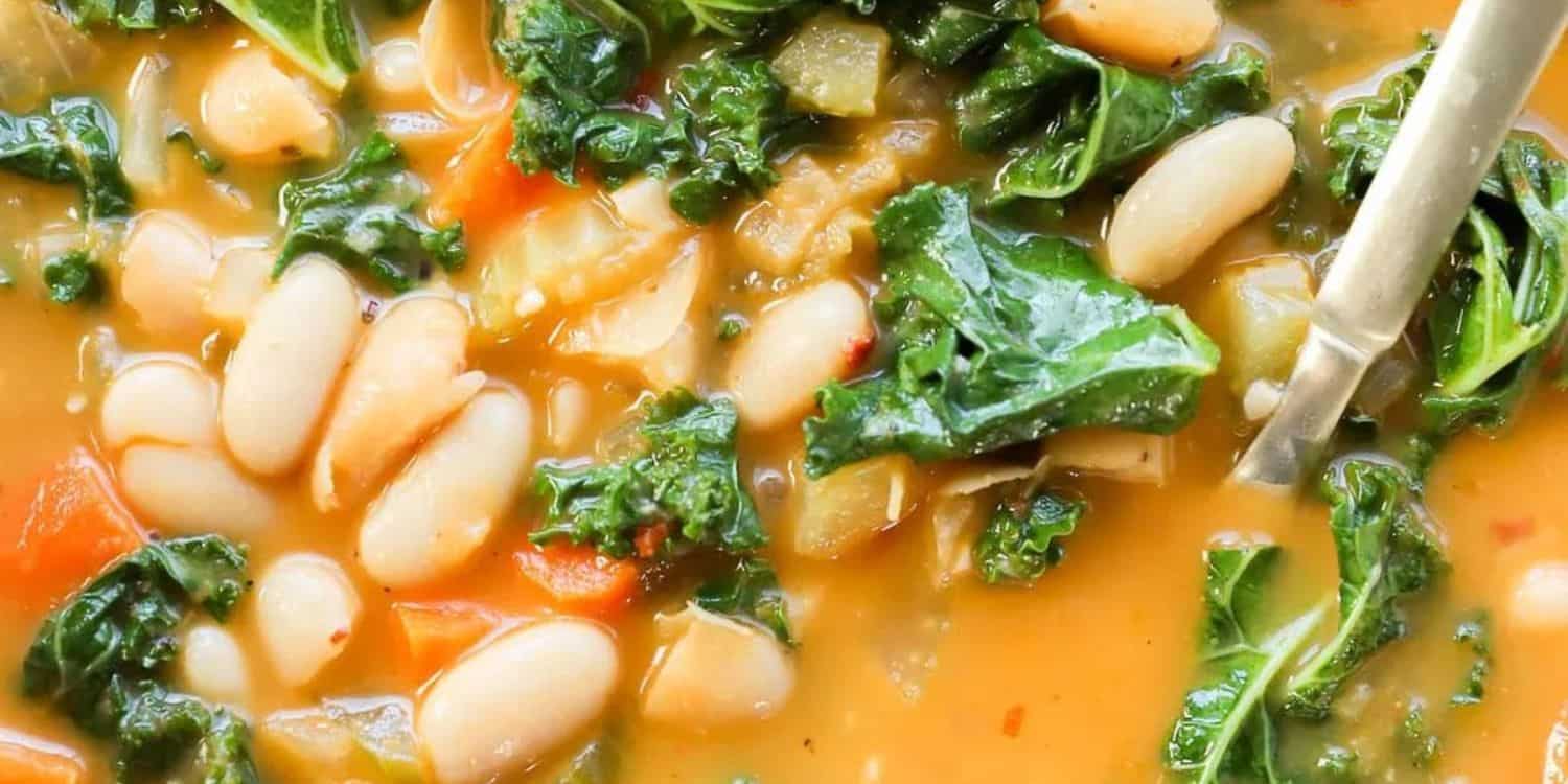A close-up shot of Tuscan White Bean Soup. 