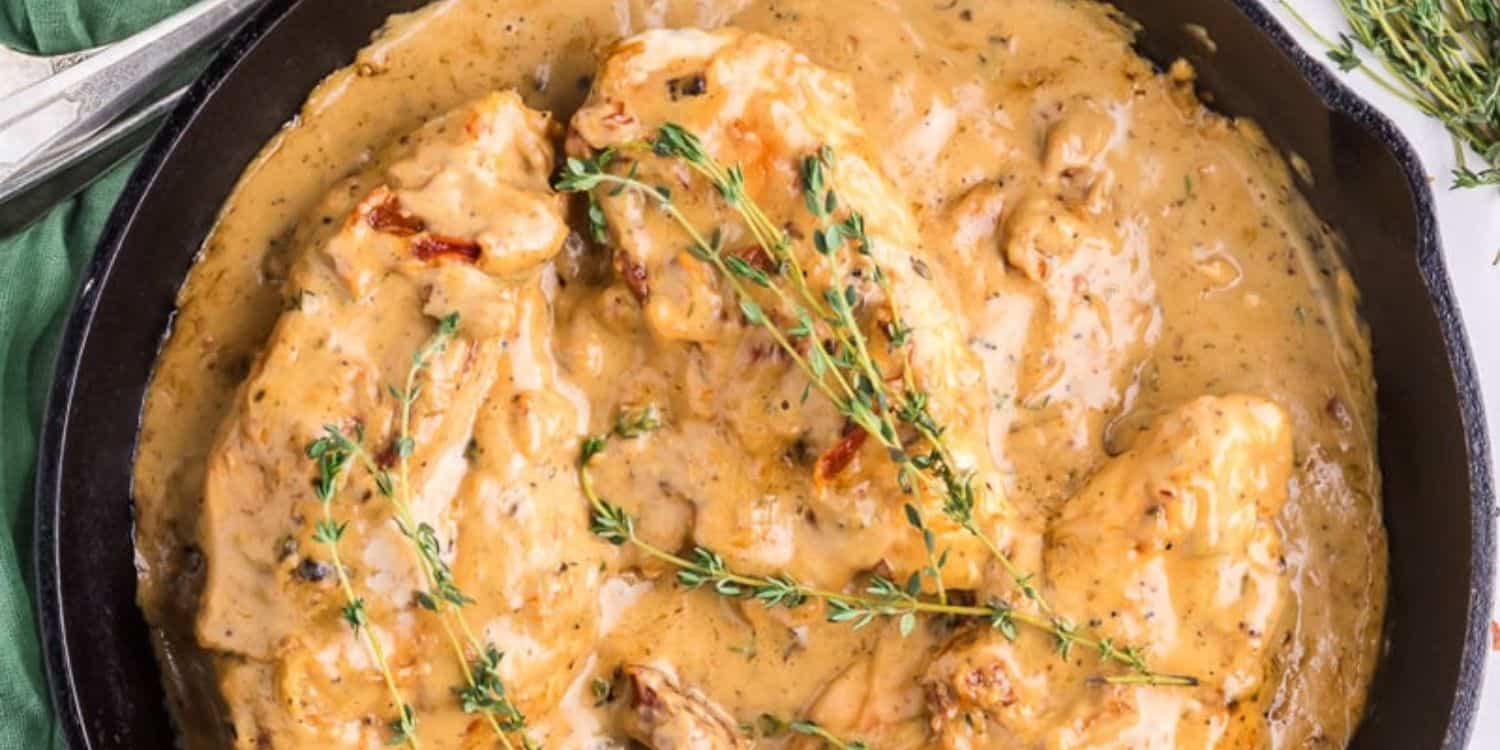 Chicken with cream sauce on a pot.