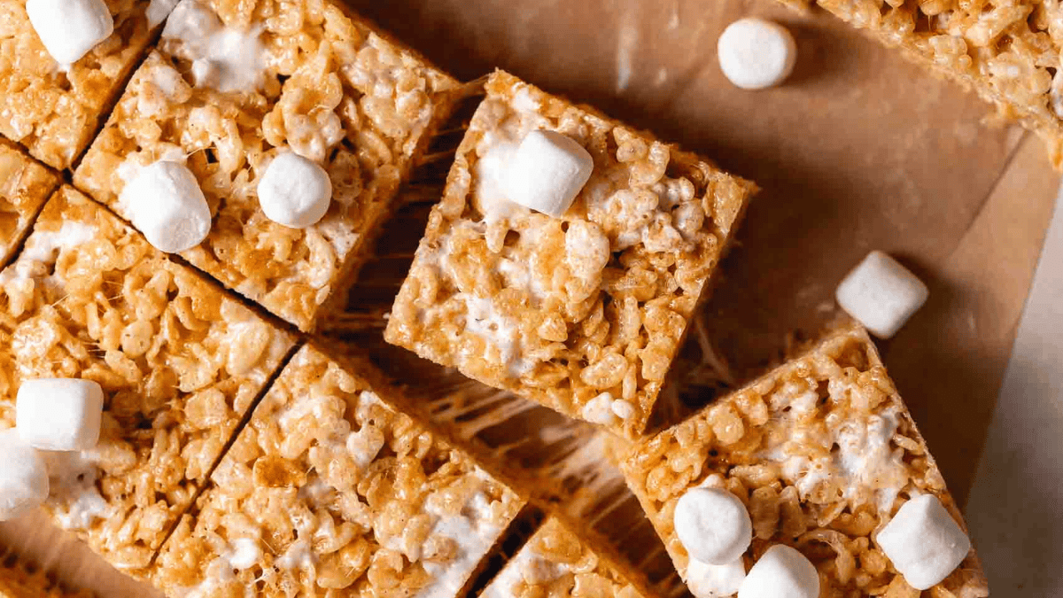 sliced in squares Brown Butter Rice Krispie Treats topped with mini marshmallows