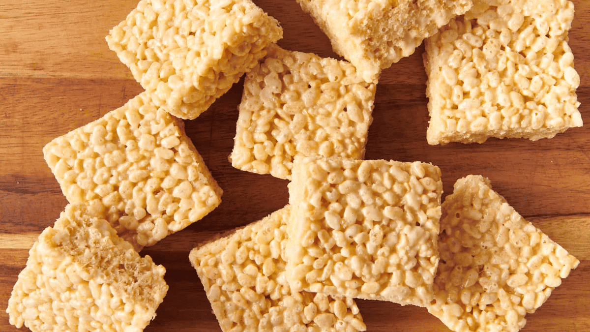 Rice Krispie Treats squares on a wooden board