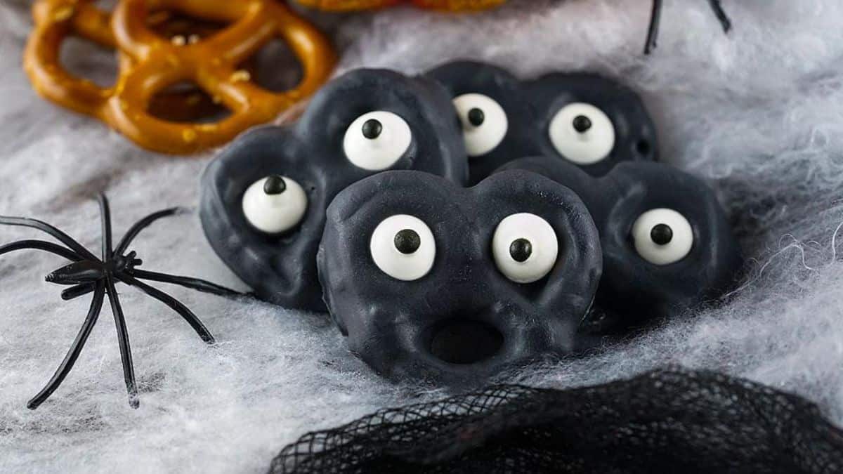 black chocolate covered pretzels with googly eyes