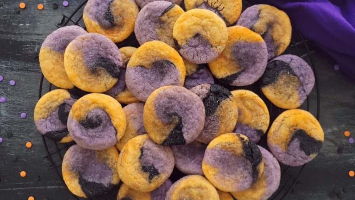 round sugar cookies swirled with yellow, purple, and black food coloring