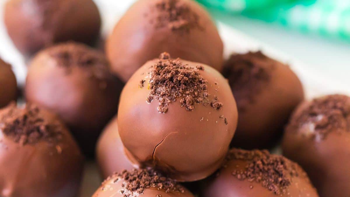 a pile of chocolate covered truffles