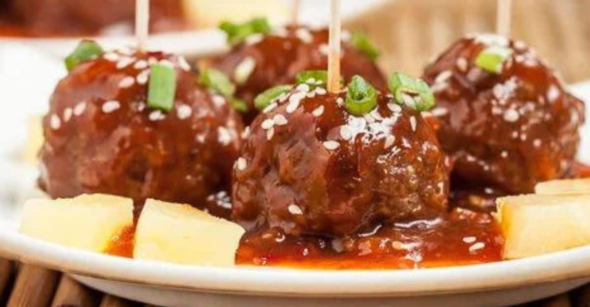 four saucy meatballs on the plate 