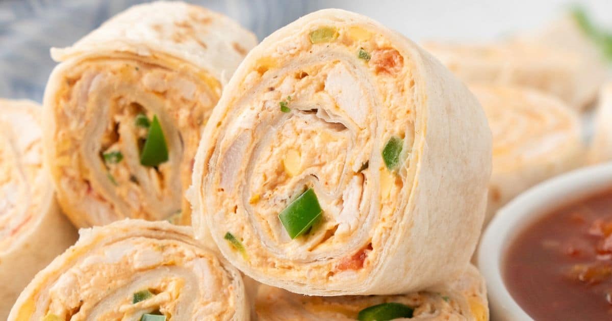 sliced pinwheel wrap ups with taco filling with cheese, chicken, green pepper