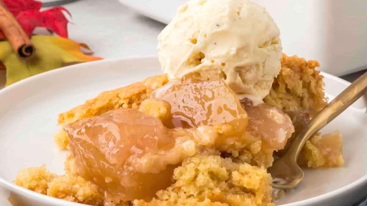 a portion of apple cobbler served with vanilla ice cream