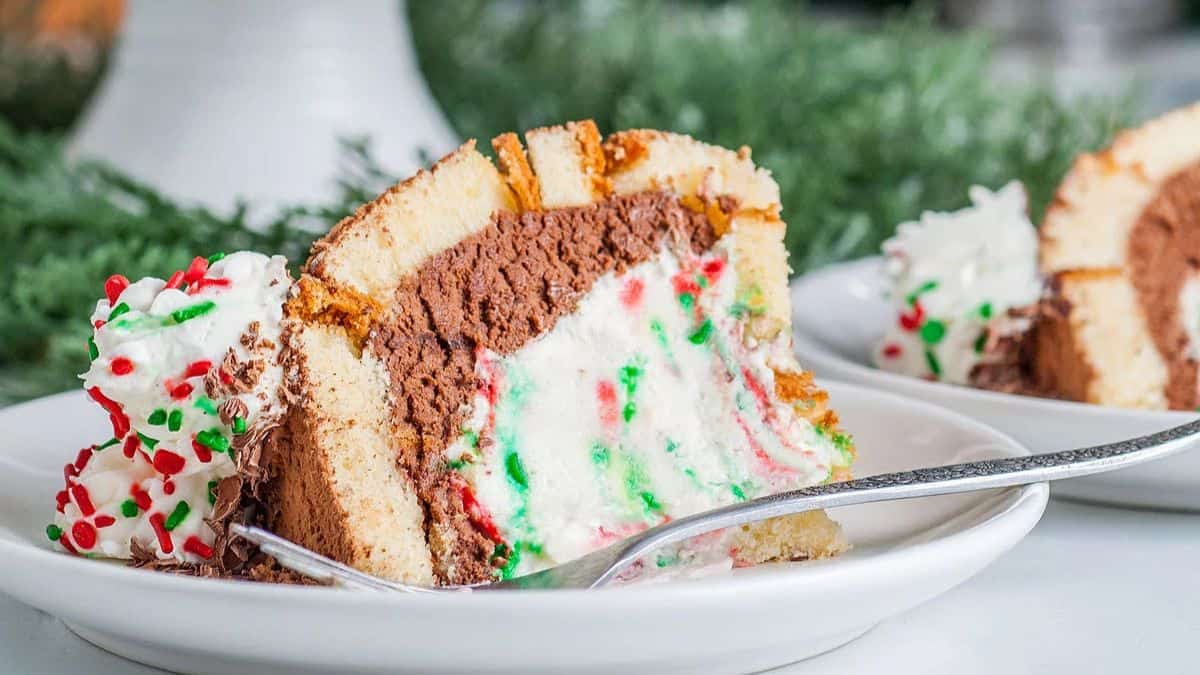 A slice of Easy Italian Christmas Zuccotto Cake, on a plate with a fork.