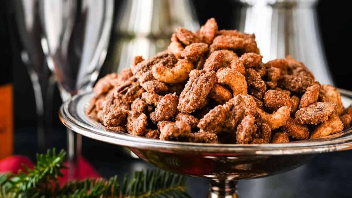 a metal bowl with sweet spicy nuts