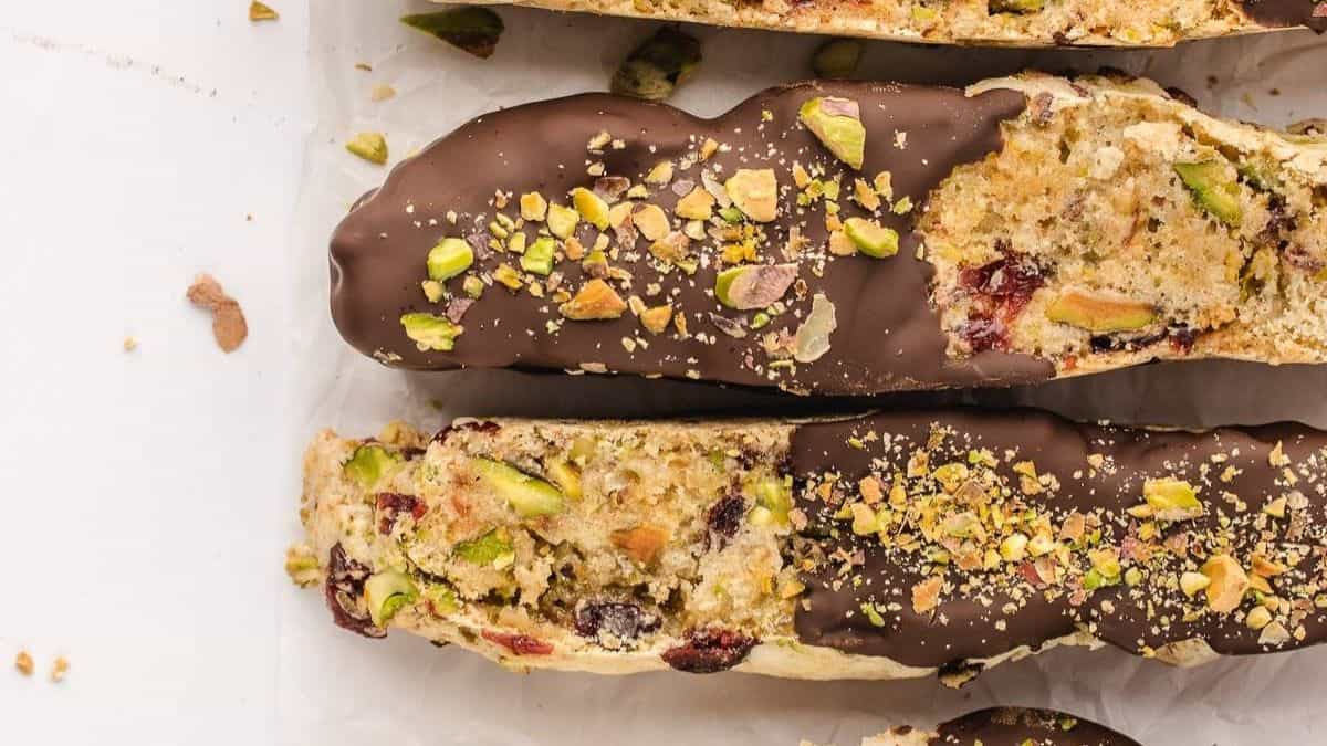 pistachio biscotti dipped in chocolate on one end