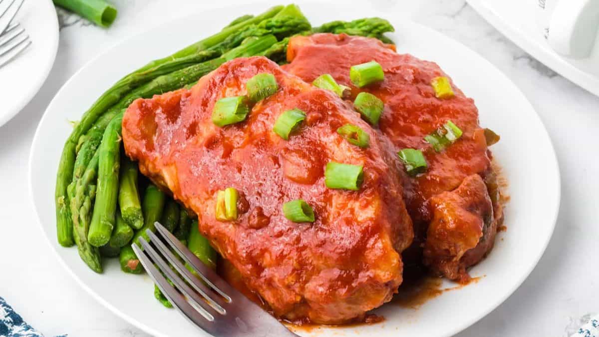 BBQ Pork Chops plated with long beans on the side.